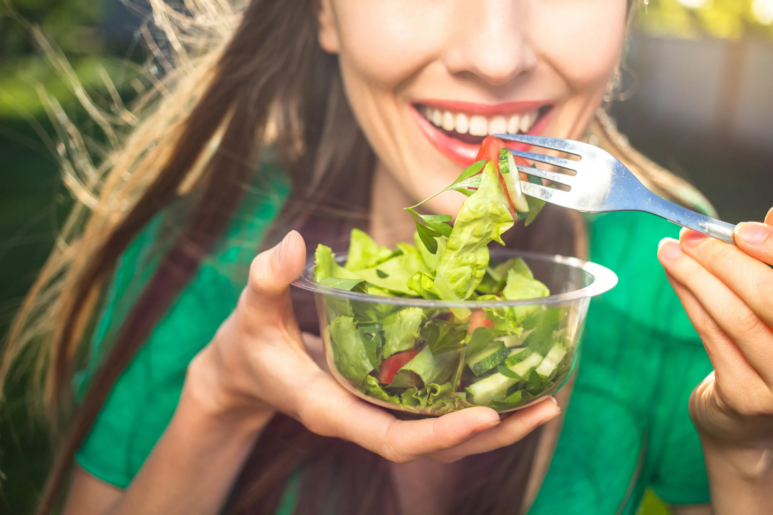 A woman eating salad